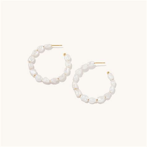 mejuri pearl hoop earrings.